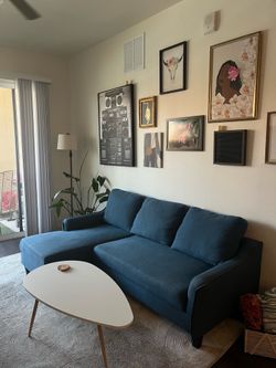 Blue sofa with bed extension