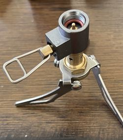 Ultralight backpacking or camping stove, designed for portability and efficiency in outdoor