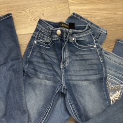 bootcut jeans with gems in the back 