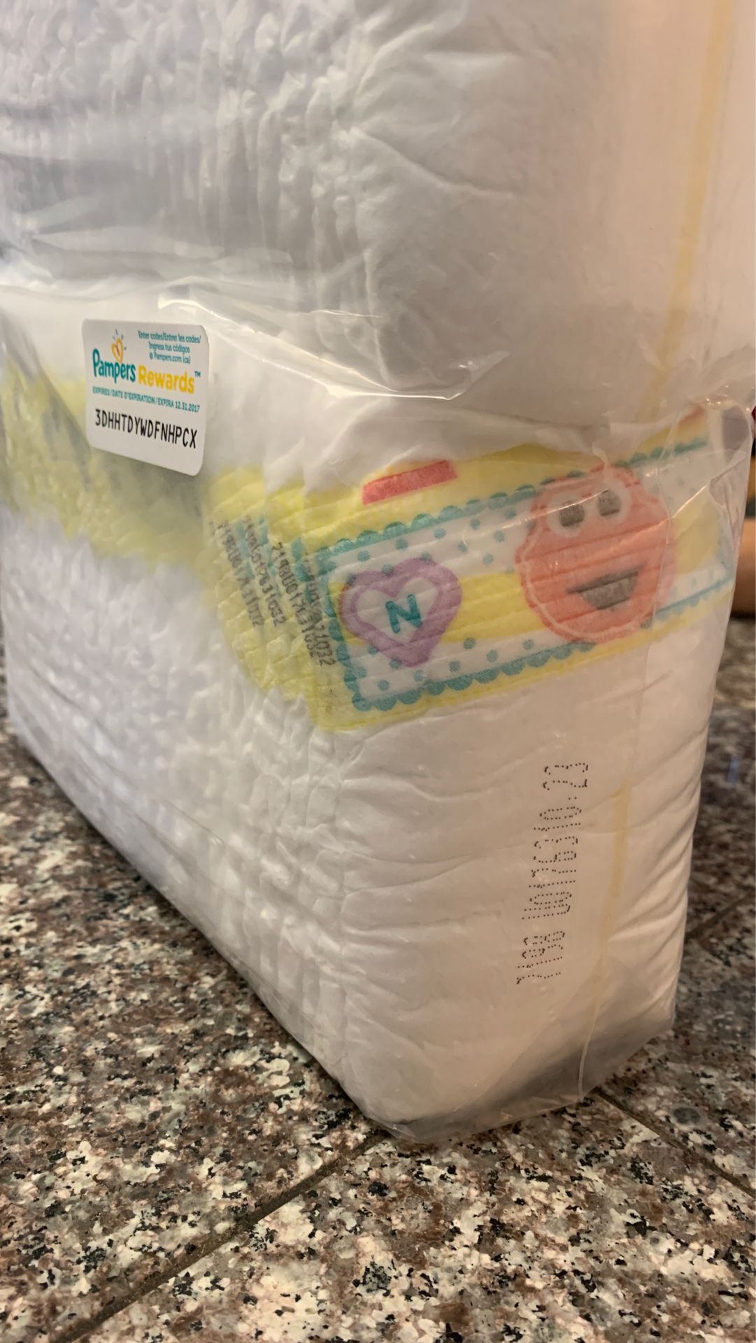 Unopened 54count newborn diapers.
