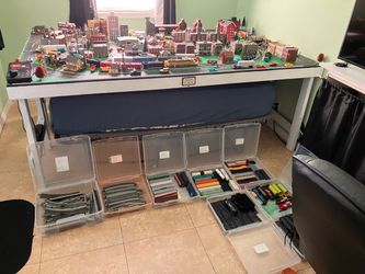 Complete train layout with trains, accessories, and 5 x 8 table