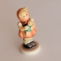 Vintage Goebel Hummel Little Girl With Doll porcelain figurine #239/B,. 
Pre-owned, very good shape, no chips or cracks.  Made in Germany. Weight 
1.7