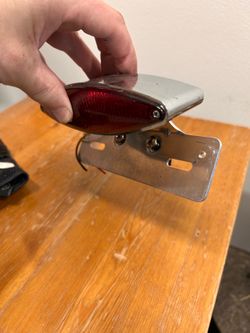 Taillight for bobber, cafe custom motorcycle with license plate holder