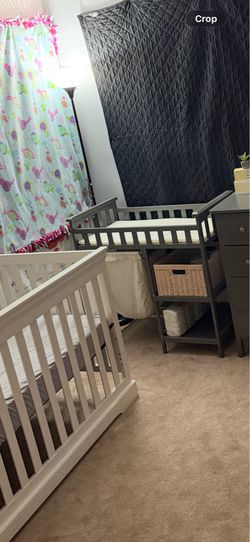 Baby changing table with two shelves and a hamper Baby changing table with two shelves and a hamper
