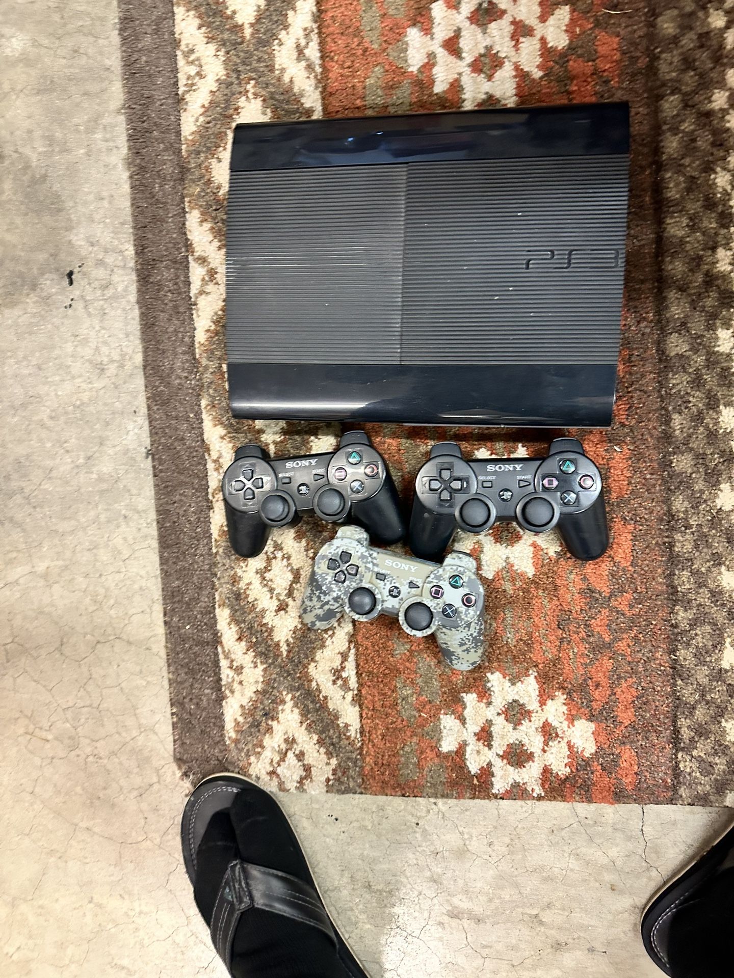 PS3 with games and game controls