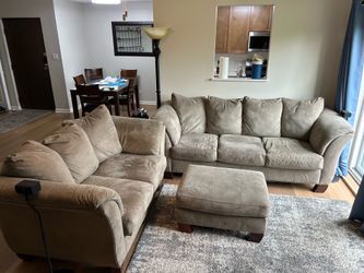 Beige sofa, live seat, and ottoman