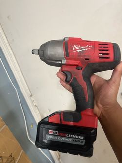 Milwaukee M18 1/2-inch High Torque Impact Wrench paired with an M18 battery