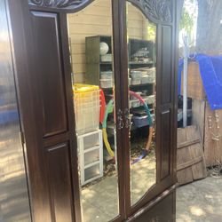 Cherrywood Armoire w/mirrored doors sits On Bench With Two Drawers