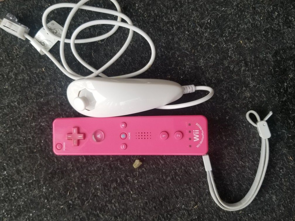 Used as is Pink Nintendo Wiimote and nunchuck with extras