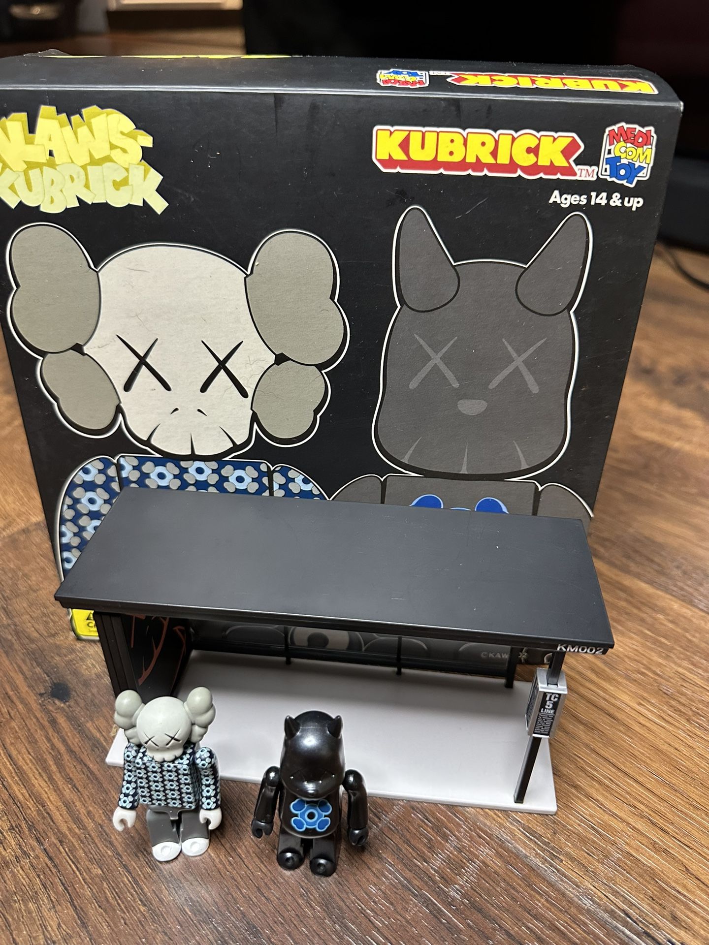 KAWS x Medicom Kubrick Bus Stop Series 1 (2002) – Limited Edition Collectible For sale is a rare and highly sought-after KAWS Kubrick Bus Stop Series