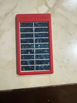 World Panel SunStream portable solar panel charger, featuring a rugged red plastic casing.