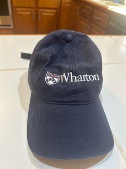 navy blue Mens Legacy navy Pennsylvania Quakers Wharton Adjustable Hat featuring the Wharton School crest and wordmark.