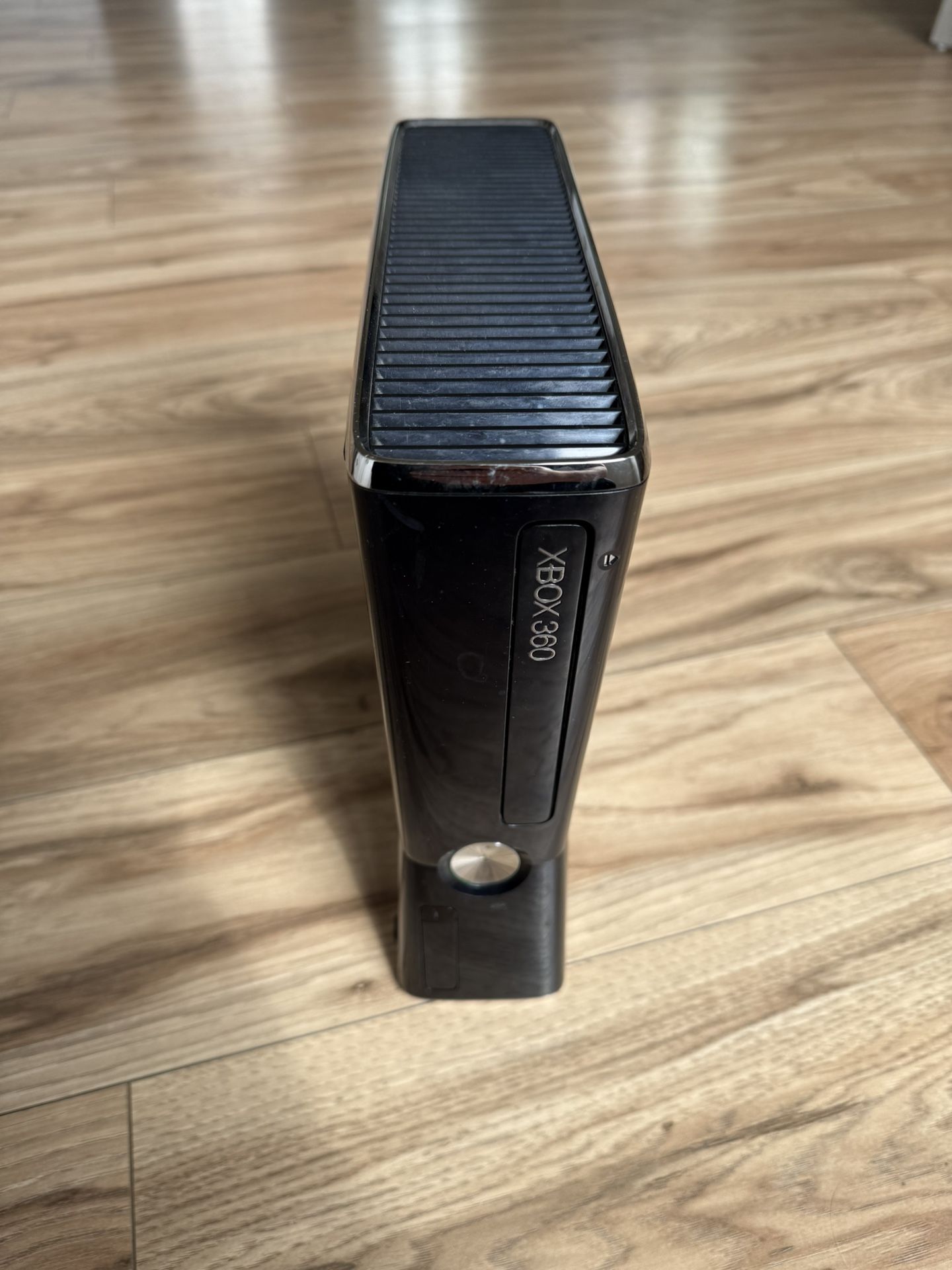 Xbox 360 Black Console Sleek black Xbox 360 console. Perfect for gaming enthusiasts. Used, In Good Condition, Works Perfectly! Includes loose games!