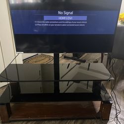 50 in samsung smart tv, stand included, +  fire tv stick 4k