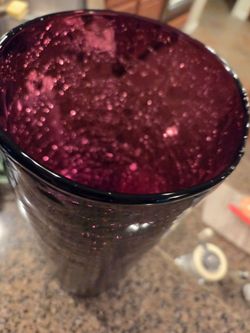 Antique vase made to look like it's shattered, but it's not. It's the way it's made, and it's a purple color and it's very large