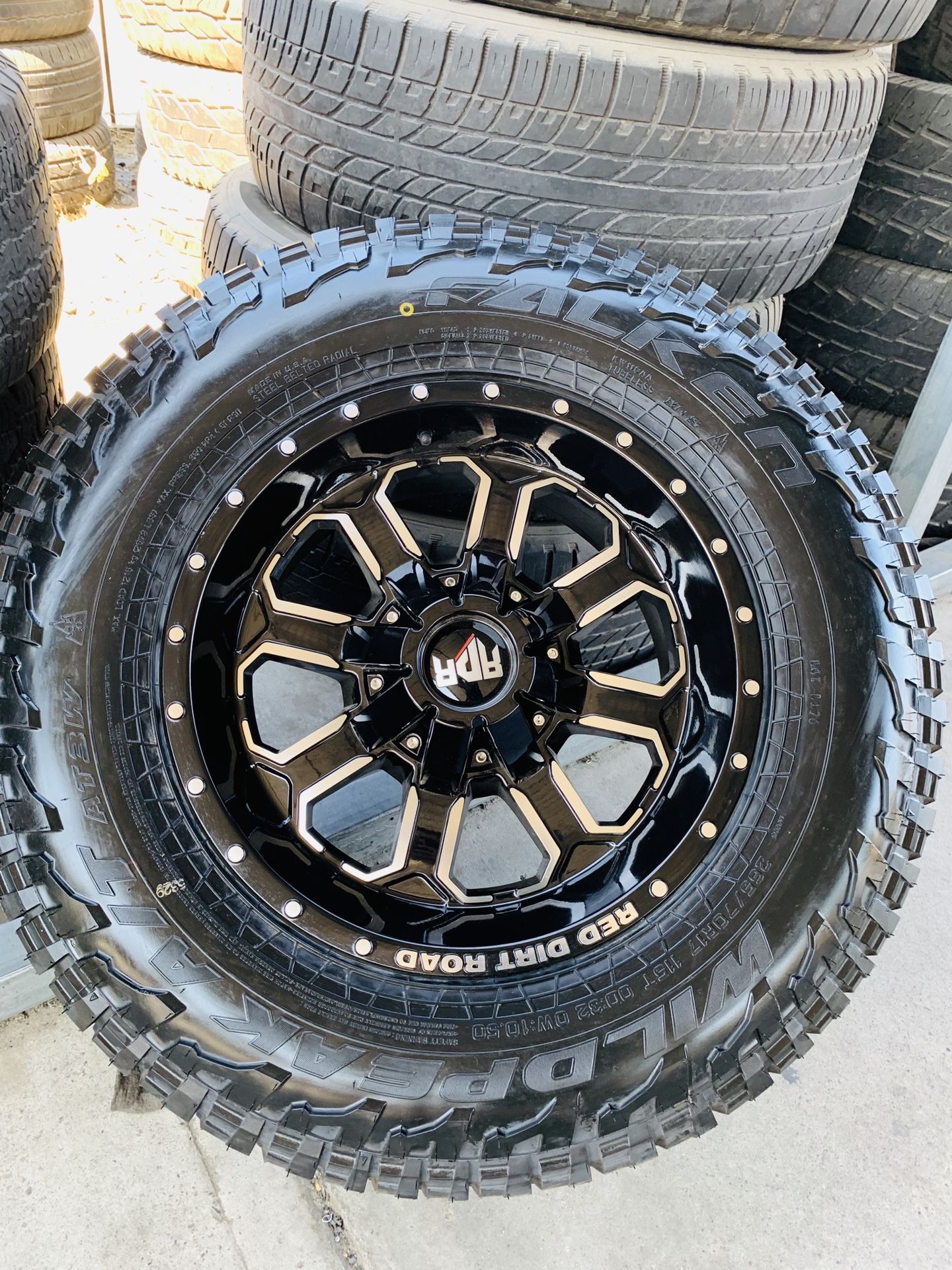 17” new gloss black rims and falken at3w tires 2657017. 6 lug Chevy gmc Toyota