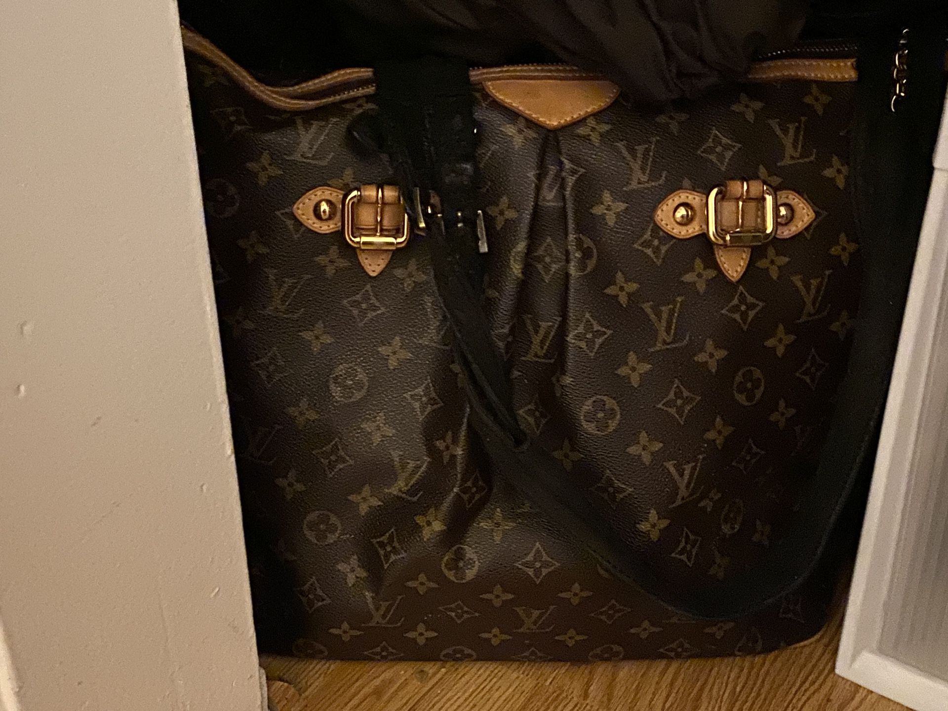 Louis Vuitton overnight bag.