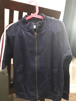 Navy Blue With White & Red Stripe on Sleeve.