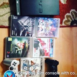 Sony ps3 slim console with 2 controllers and 5 games