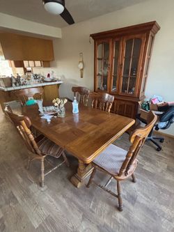 Table with five chairs and China hutch