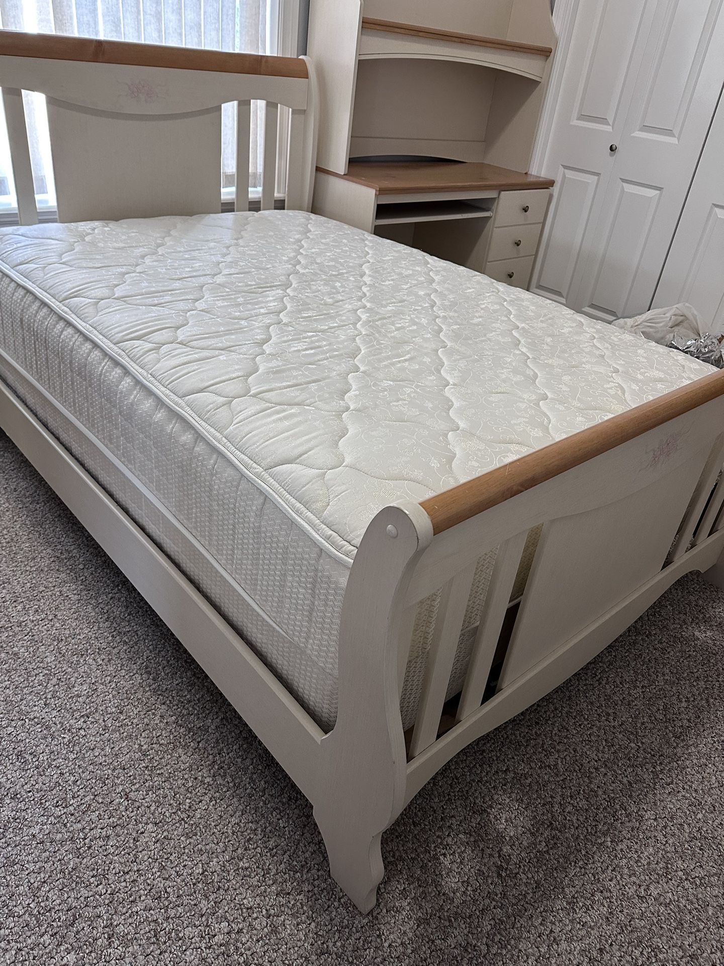Full size white and wood bed with mattress, spring box and with the matching study desk.