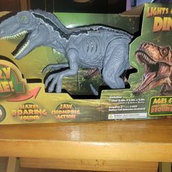 💥NEW DINOSAUR THAT HAVE LIGHTS AND MAKES SOUNDS AND JAW MOVES. .  ADJUSTABLE  ARMS, LEGS, AND HEAD