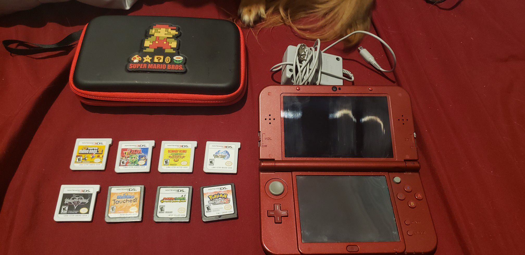 New Nintendo 3DS XL + games, case, and charger