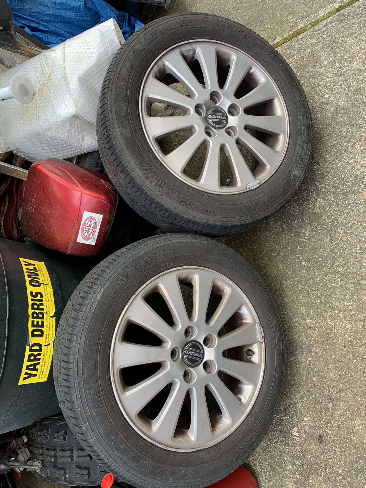 Two Volvo s40 rims with tires.