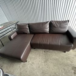 Brown Leather Couch - adjustable seating arrangement with storage