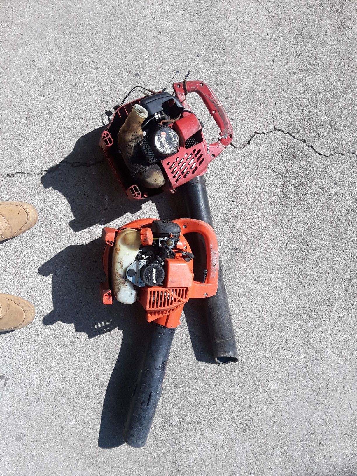 Two leaf blowers