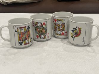 Set of 4 ceramic mugs featuring playing card designs. Jack, Queen, King, Joker
