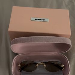 Miu miu sunglasses in brown shade .Newer worn 