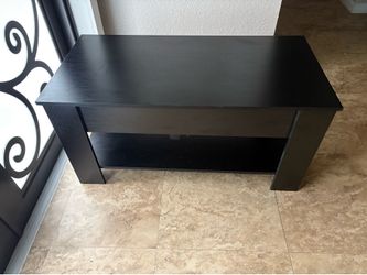 Black wood center table with compartment