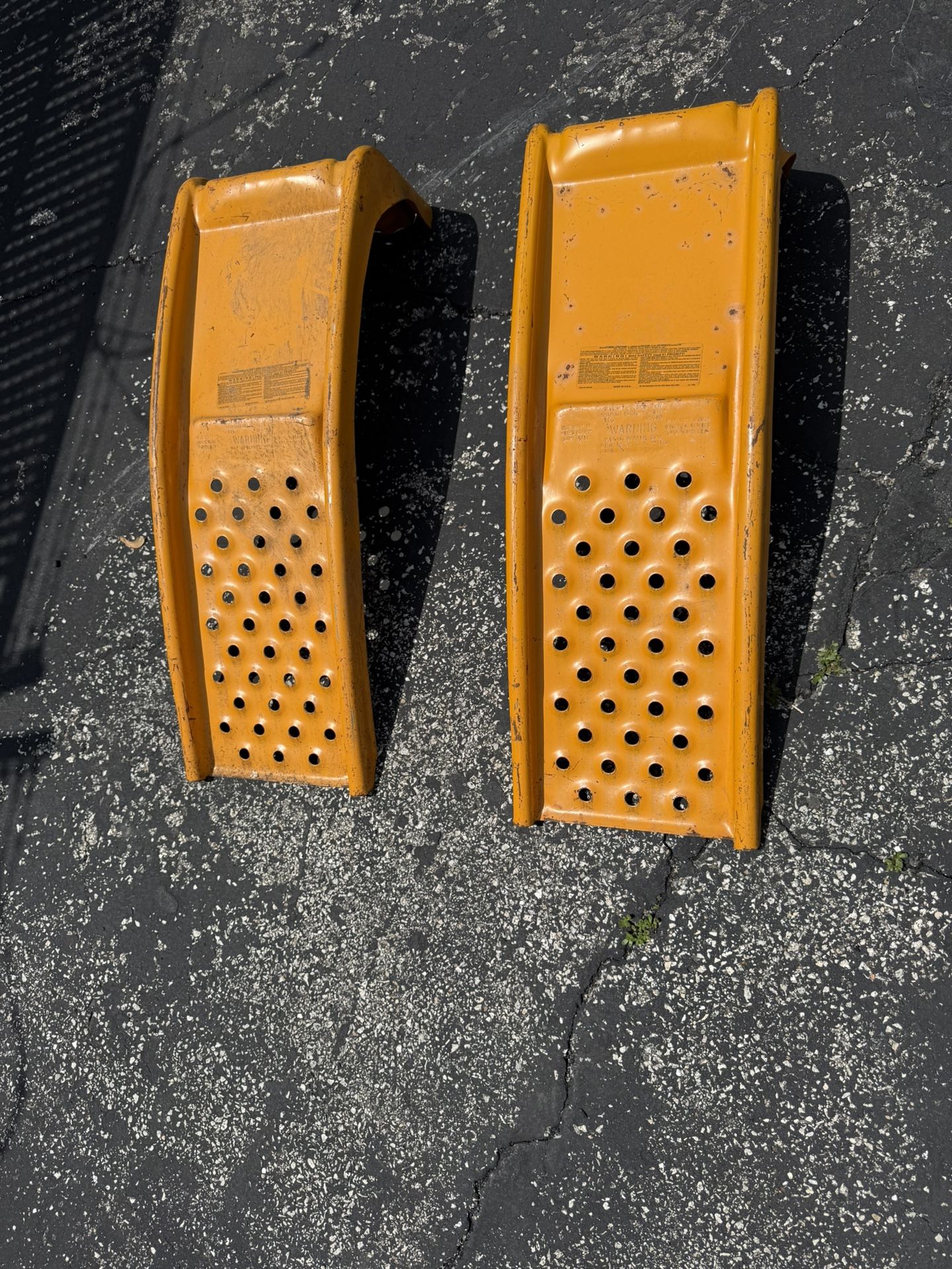 SET OF TWO HEAVY DUTY METAL CAR RAMPS IN GOOD CONDITION. $40.00 OR BEST OFFER.