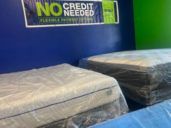 New Mattresses Still in Plastic Wrap