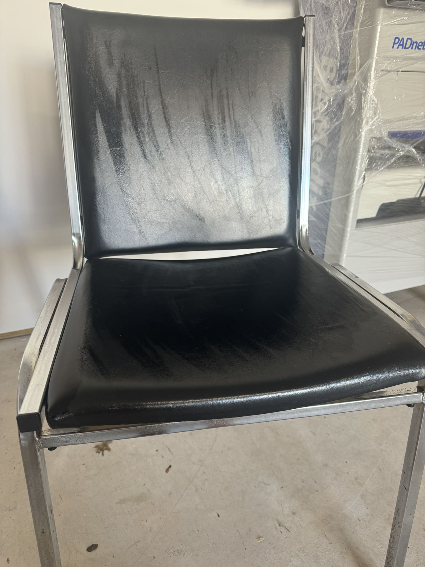 Black Leather Cushioned Chair