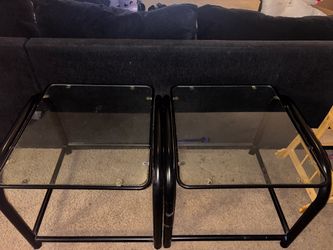 2 black glass side tables