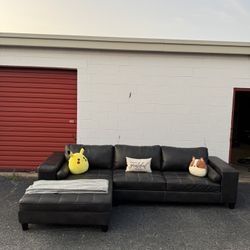 Ashley Charcoal Faux Leather Sectional