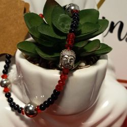 Red And Black Beaded Bracelet With Silver Buddha