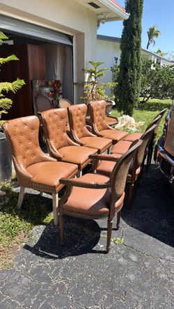 6 antique dining chairs and 4 leather chairs