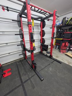 Red and Black Power Rack with Weight Plates