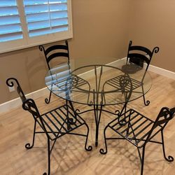 Glass Table withe Metl Base and 4 Metal Chairs