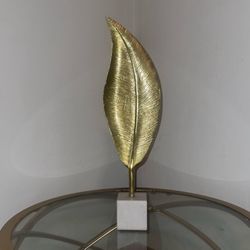 Tall standing feather statue