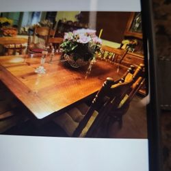  Dining room set table 2 leaves not showing in picture 6 chairs. Dry bar, an extra large China cabinet that comes in 2 pieces.  A a custom table cover