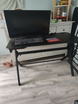 Gaming desk with monitor and keyboard