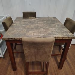 Used Marble top table and chairs.  47x47