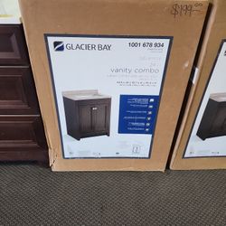 Glacier Bay
Delridge 25 in. Single Sink Chocolate Bath Vanity with Caramel Cultured Marble Top (Assembled)