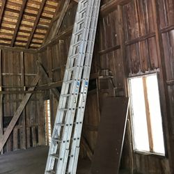 Two 36 Ft. Werner Self Leveling  Extension Ladders 