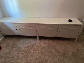 Two white IKEA PS Cabinets