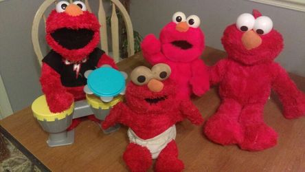 Tickle Me Elmo, Alphabet singing Elmo, LG.Stuffed Elmo and the last one sings and plays the drums and tambourine